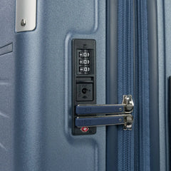 Close-up detail of the Travelpro Platinum Elite Medium Check-In Hardside Spinner in Dark Sky Blue, showing the integrated TSA-approved combination lock and secure zipper pulls on the polycarbonate shell.