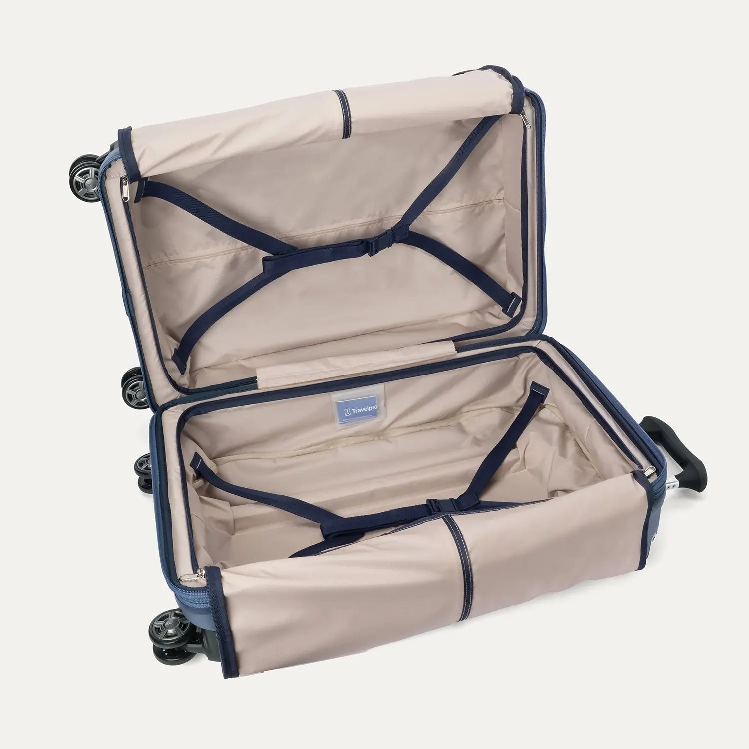 Interior view of the Travelpro Platinum Elite Medium Check-In Hardside Spinner in Dark Sky Blue, showing the adjustable hold-down straps and the spacious main compartment with ECOFAB™ lining.