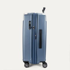 Side profile view of the Travelpro Platinum Elite Medium Check-In Hardside Spinner in Dark Sky Blue, shown in its expanded position to highlight the 2-inch zippered expansion feature and side carry handle.