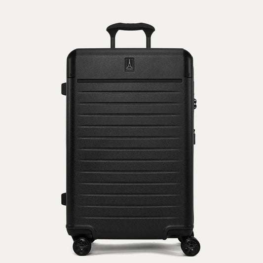 Front view of the Travelpro Platinum Elite Medium Check-In Hardside Spinner in Jet Black, featuring a durable polycarbonate shell, polished aluminum corner armor, and genuine leather trim.