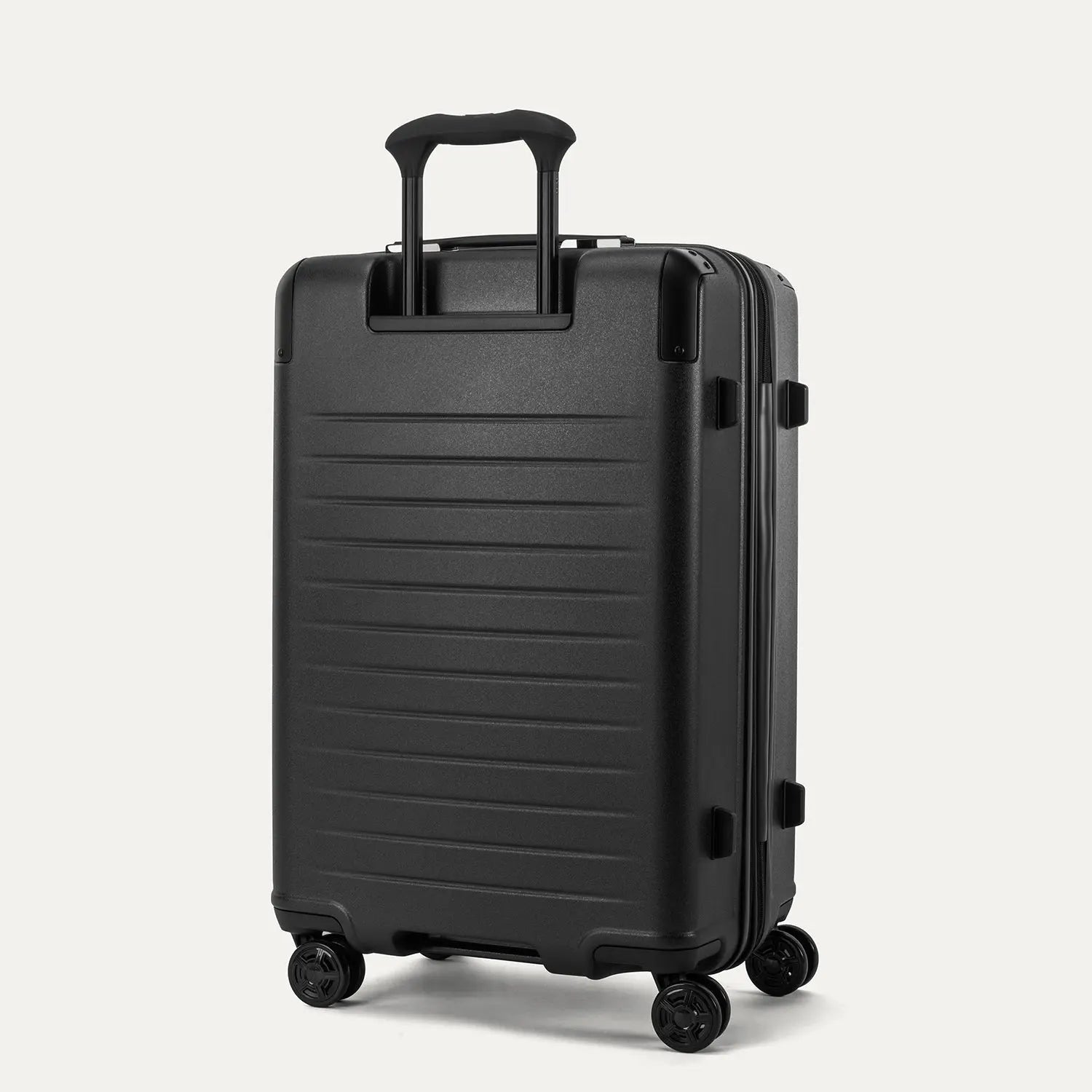 Rear view of the Travelpro Platinum Elite Medium Check-In Hardside Spinner in Jet Black, showing the sturdy PowerScope Lite handle and the durable, textured polycarbonate shell.