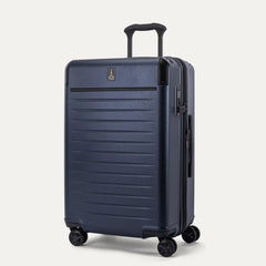 Three-quarter angled view of the Travelpro Platinum Elite Medium Check-In Hardside Spinner in Aviator Navy, showing the extended PowerScope Lite handle, integrated TSA lock, and dual spinner wheels.