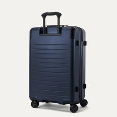 Rear view of the Travelpro Platinum Elite Medium Check-In Hardside Spinner in Aviator Navy, showing the durable, textured polycarbonate shell and the sturdy PowerScope Lite telescoping handle.