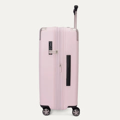 Side view of the Travelpro Platinum Elite Medium Check-In Hardside Spinner in Powder Pink, featuring a durable polycarbonate shell with polished aluminum corner armor, an extended telescopic handle, and multi-directional wheels against a clean off-white background.