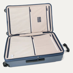 Interior view of the Travelpro Platinum Elite Large Check-In Hardside Spinner in Dark Sky Blue, featuring dual zippered divider panels and the ECOFAB™ lining made from recycled plastic bottles.