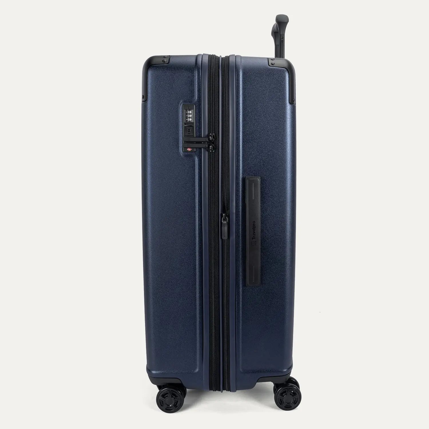 Side profile view of the Travelpro Platinum Elite Large Check-In Hardside Spinner in Aviator Navy, showing the expansion zipper, integrated TSA-approved lock, and side carry handle.