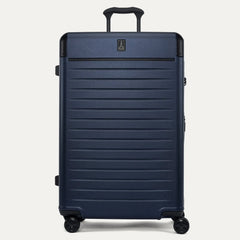 Front view of the Travelpro Platinum Elite Large Check-In Hardside Spinner in Aviator Navy, featuring a high-impact polycarbonate shell, aluminum corner armor, and genuine leather trim.