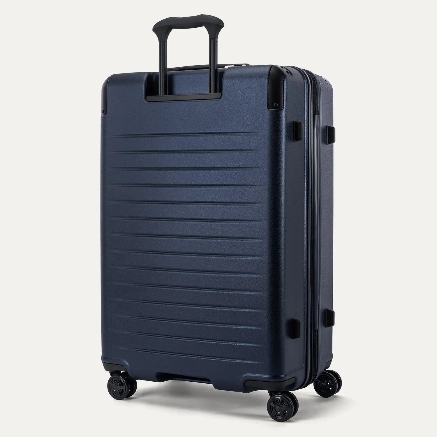 Rear view of the Travelpro Platinum Elite Large Check-In Hardside Spinner in Aviator Navy, showing the sturdy PowerScope Lite handle and the durable, textured polycarbonate shell.