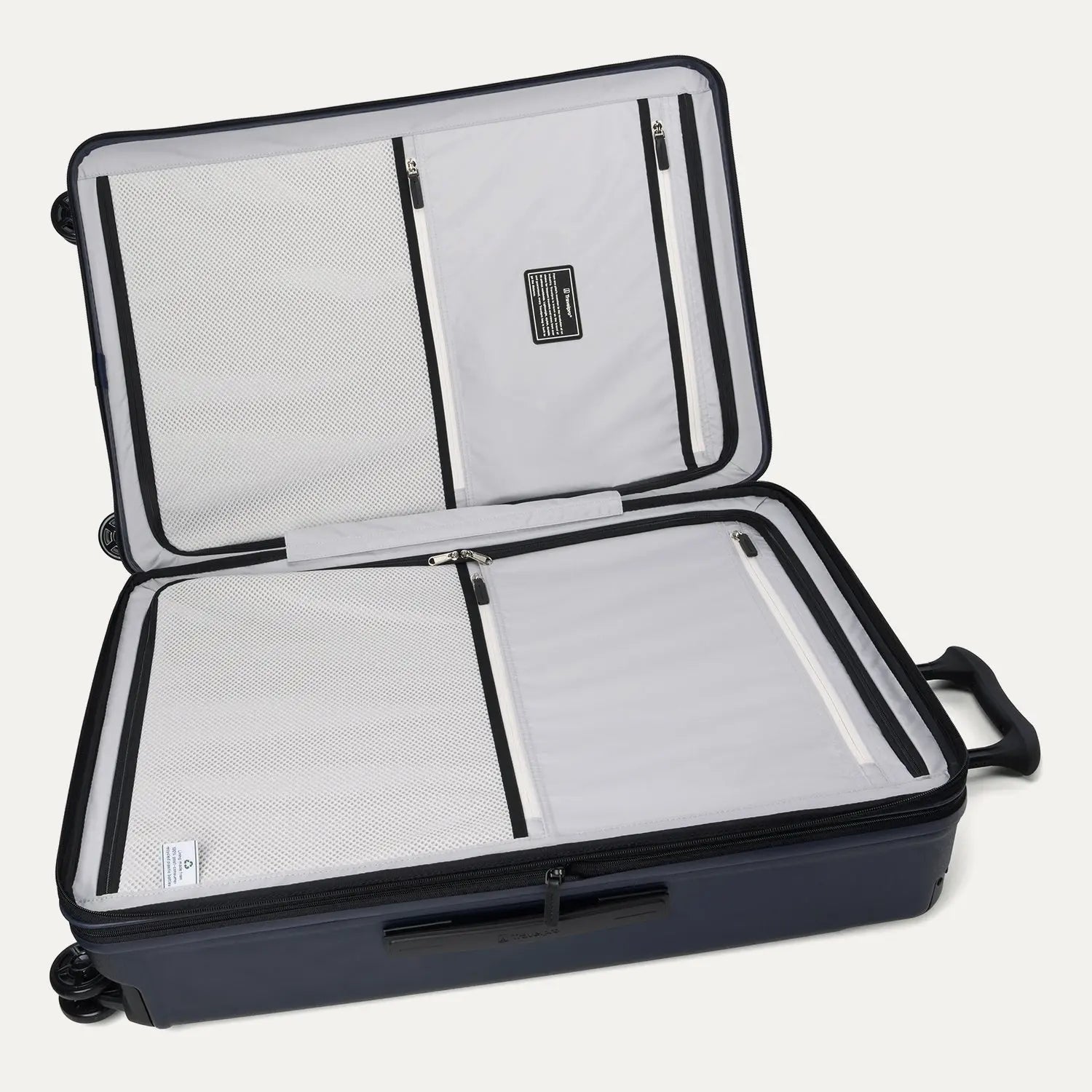Interior view of the Travelpro Platinum Elite Large Check-In Hardside Spinner in Aviator Navy, featuring dual zippered divider panels and the ECOFAB™ lining made from recycled plastic bottles.