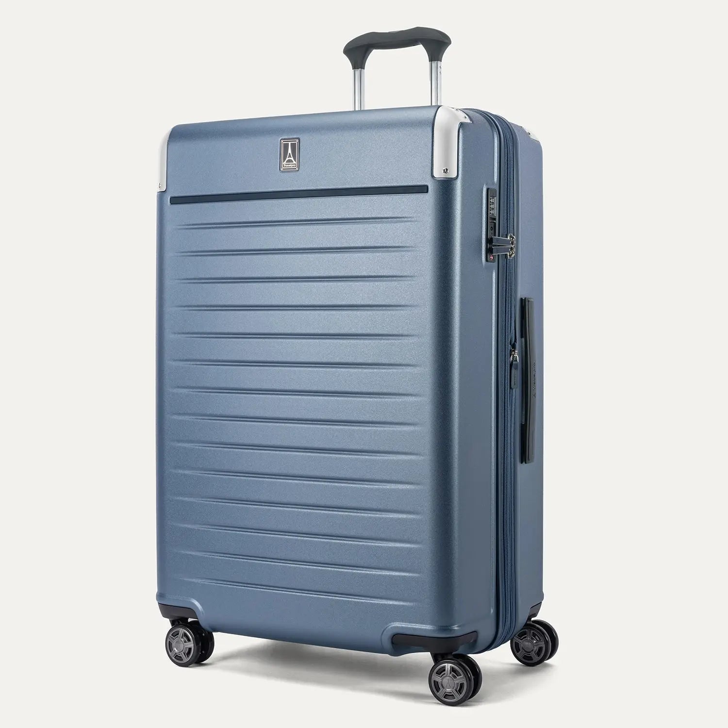 Front 3/4 view of the Travelpro Platinum Elite Large Check-In Hardside Spinner in Dark Sky Blue, featuring a high-impact polycarbonate shell, aluminum corner armor, and 360-degree spinner wheels.